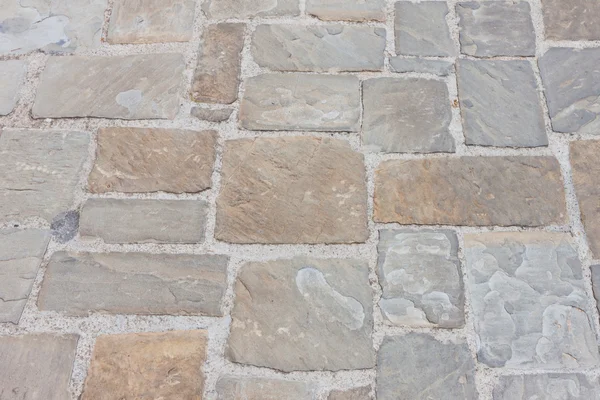 La pavimentazione in pietra come sfondo — Foto Stock