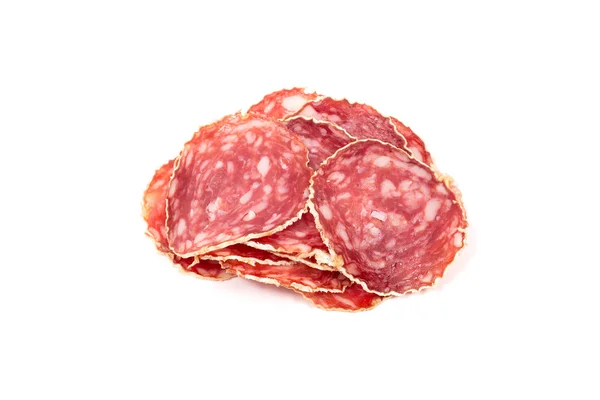 Segmenten van salami worst op een witte achtergrond — Stockfoto