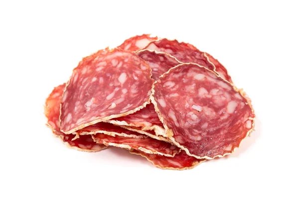 Slices of salami sausage on a white background Stock Image