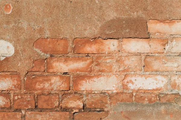 Brick wall with cracked plaster - texture — Stock Photo, Image