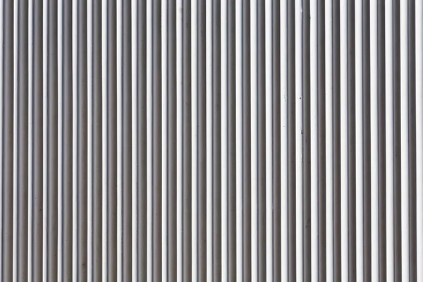 Gestreepte grijze betonnen muur achtergrond textuur — Stockfoto