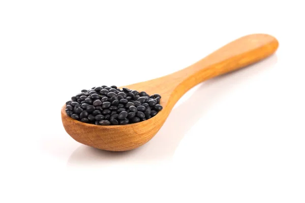 Black Organic Lentils Wooden Spoon Isolated White Background — Stock Photo, Image