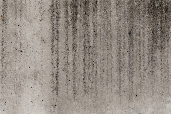 Old moldy concrete wall as abstract background texture