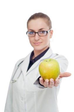 Doktor stetoskop ve elma ile. Beyaz bir arka plan üzerinde.