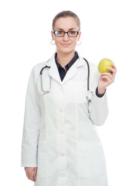 Arzt mit Stethoskop und Apfel. auf weißem Hintergrund. — Stockfoto