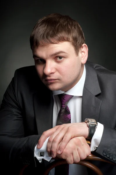 Portrait of a serious young man in a jacket. — Stock Photo, Image