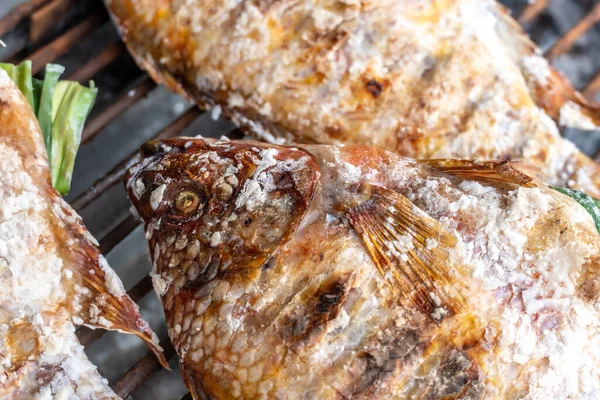 Salted and stuffed fish for sale in Northern Thailand on a grill in iopen market
