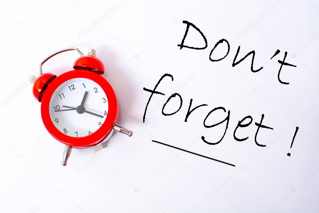 red alarm clock and don't forget notice reminder words