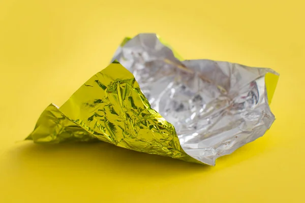 Aluminum Foil Wrap Chocolate Candy Yellow Background Texture Used Crumpled — Stock Photo, Image