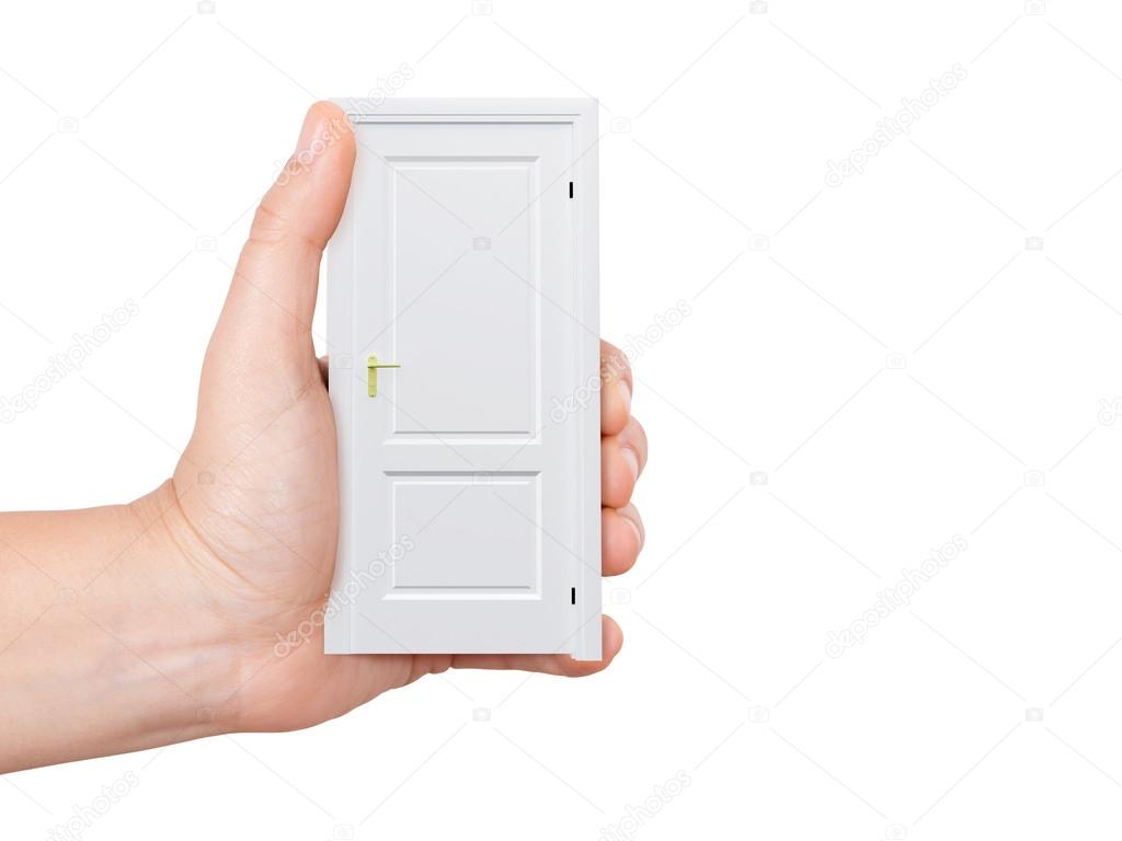 Hand Holding White Door