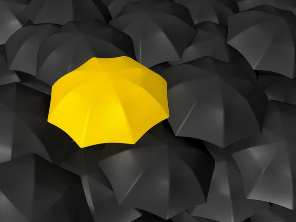Różnica żółty parasol — Zdjęcie stockowe