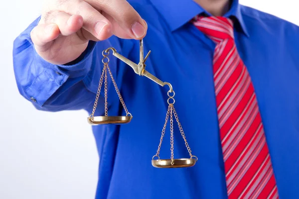 Businessman Shows Scales Stock Picture