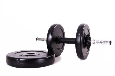 siyah dumbbell ve diskler