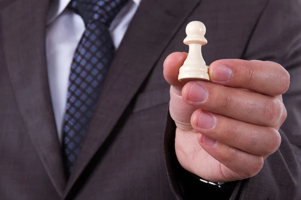 Businessman Showing Chess Piece Pawn — Stock Photo, Image