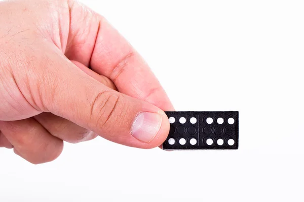 Domino in der Hand — Stockfoto