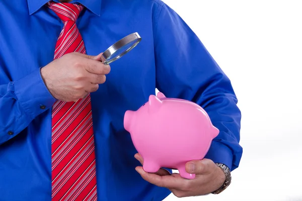 Businessman Holding Magnifying Glass and Piggy Bank — Stock Photo, Image