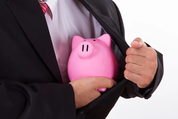 Mannen beschermt piggy bank — Stockfoto