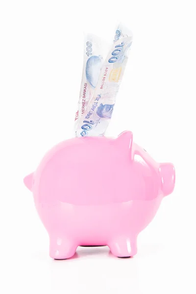 Geld in rosa Sparschwein — Stockfoto