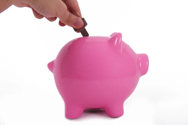 Roze piggy bank en sleutel — Stockfoto