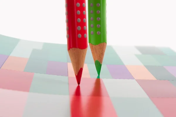 Red and Green Pencils Standing on Art Book — Stock Photo, Image