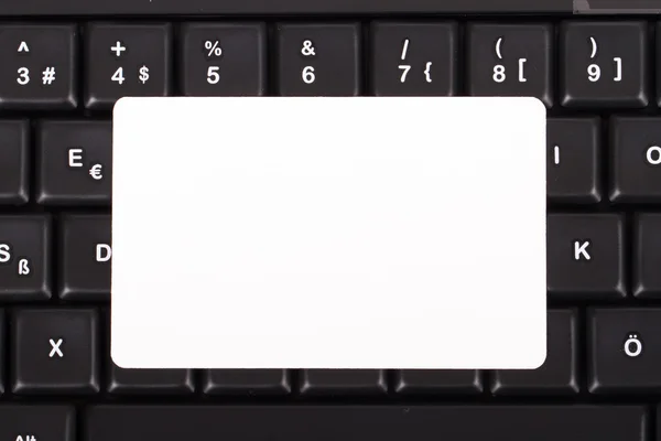Cartão no teclado — Fotografia de Stock
