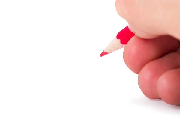 Kırmızı kalem tutan el — Stok fotoğraf