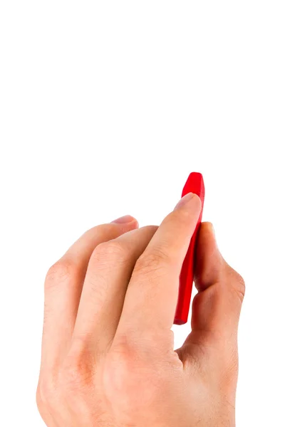 Hand hält rotes Kreidepastellkreide — Stockfoto
