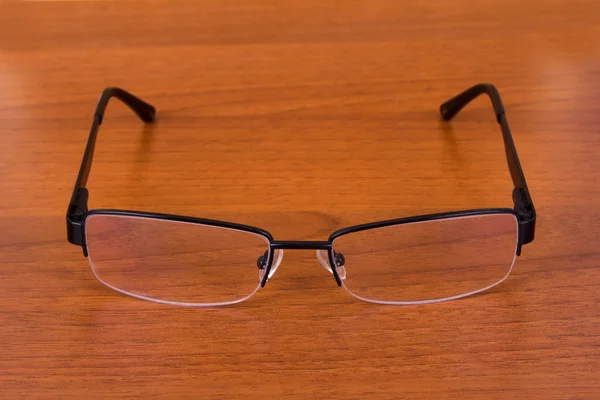 Gafas graduadas en la mesa — Foto de Stock