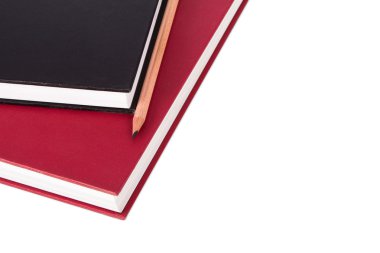 kalem ile kitap yığını