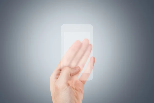 Ręka trzyma przezroczysty inteligentny telefon — Zdjęcie stockowe