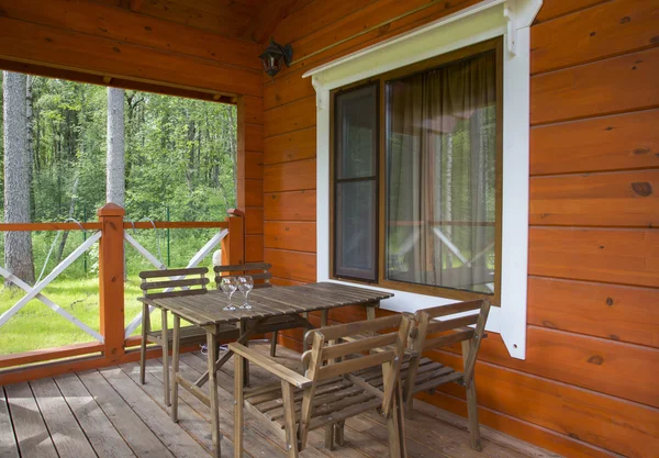 Porch of a wooden house in the forest — Stock Photo, Image