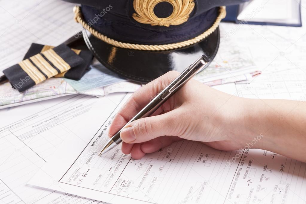 Airplane pilot filling in flight plan
