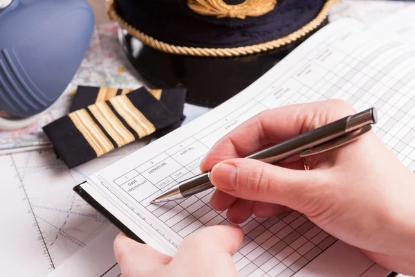 Airplane pilot filling in flight plan — Stock Photo, Image