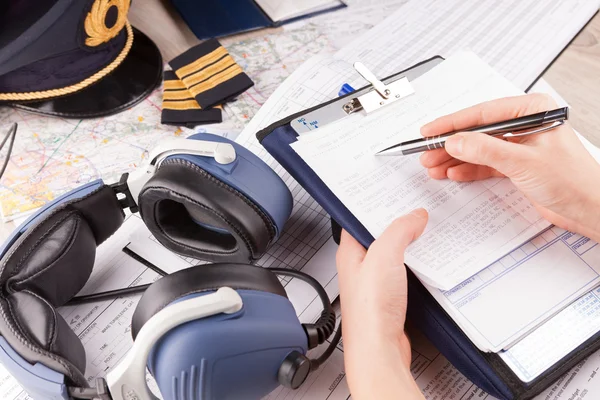 Airplane pilot filling in flight plan — Stock Photo, Image