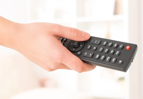 Hand holding remote controller Royalty Free Stock Photos