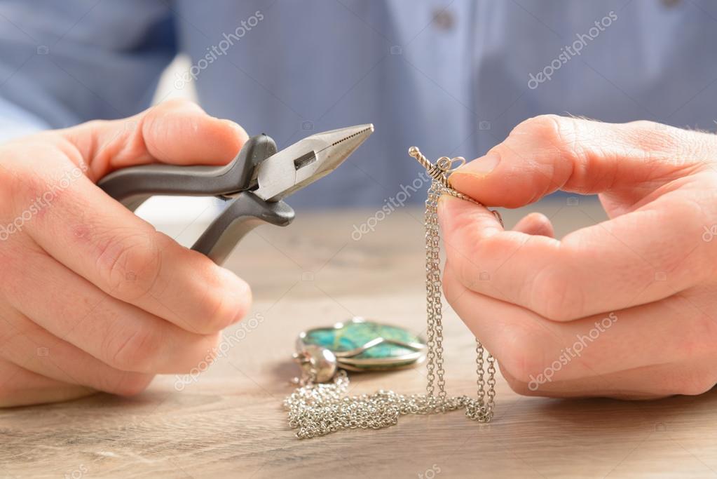 Creating or fixing jewelry — Stock Photo © Amaviael 43745151