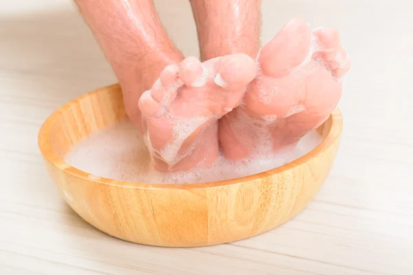 Male feets in a bowl — Stock Photo, Image