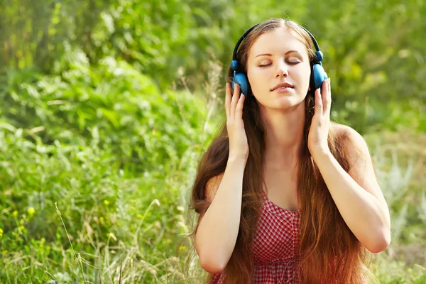 Woman with Headphones Outdoors