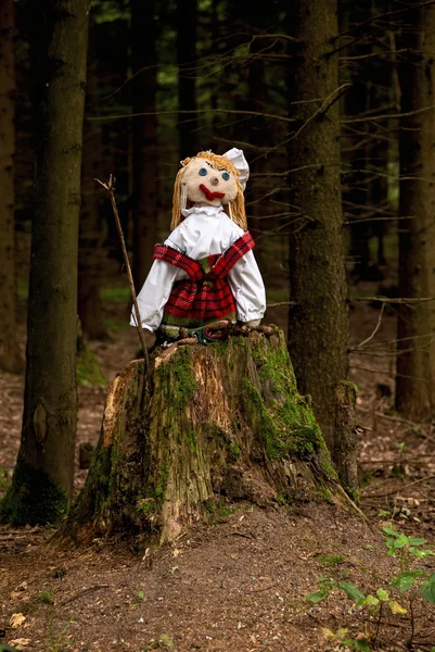 Puppet on a tree stump Stock Image