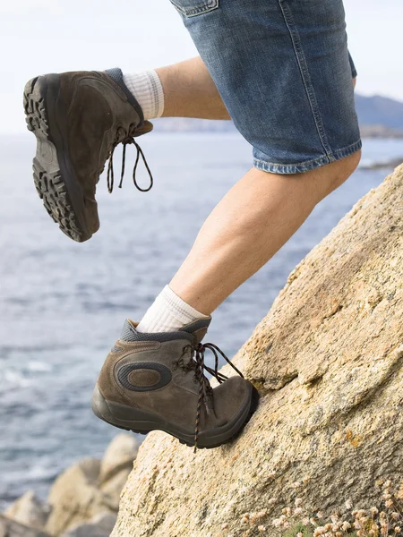 Man climbing a rock