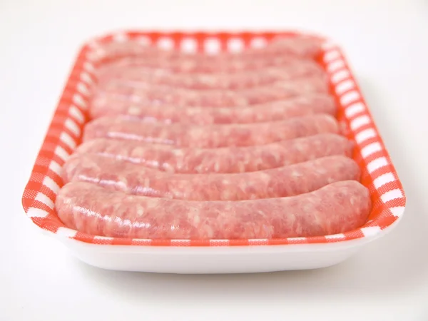 Fresh sausages on a tray — Stock Photo, Image