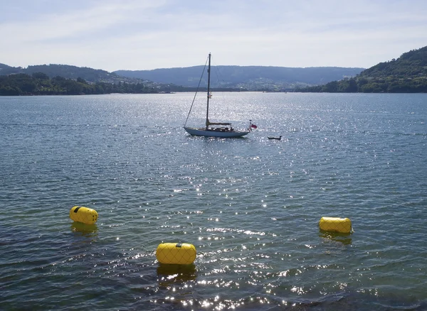 Sailboat at sea with three buoys — Stock Photo, Image