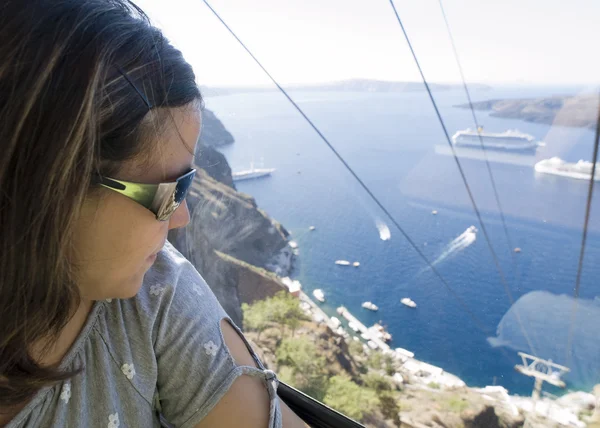 Woman looking out of a cable car — Stock Photo, Image