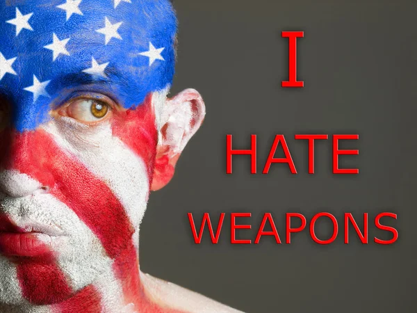 Man face flag USA, I hate weapons, looking at side — Stock Photo, Image