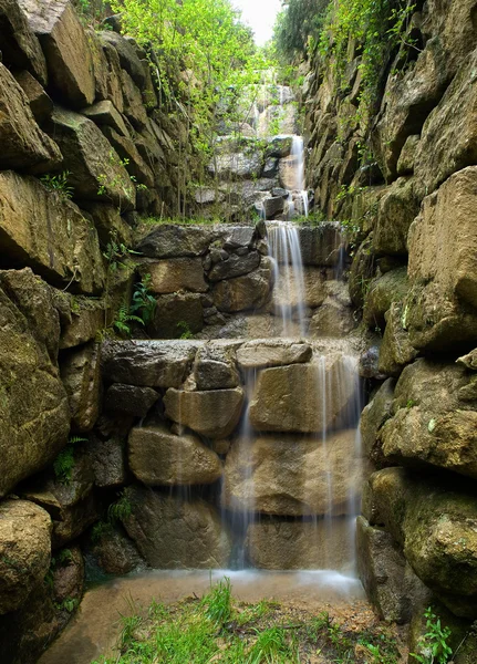 Artificial waterfall in vertical composition — Stock Photo, Image