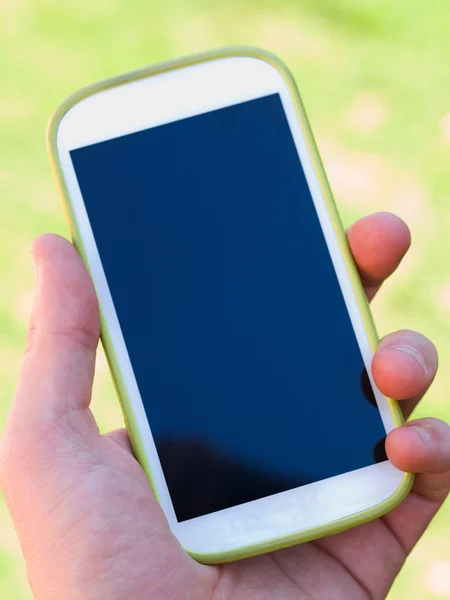 Hand holding a smart phone — Stock Photo, Image