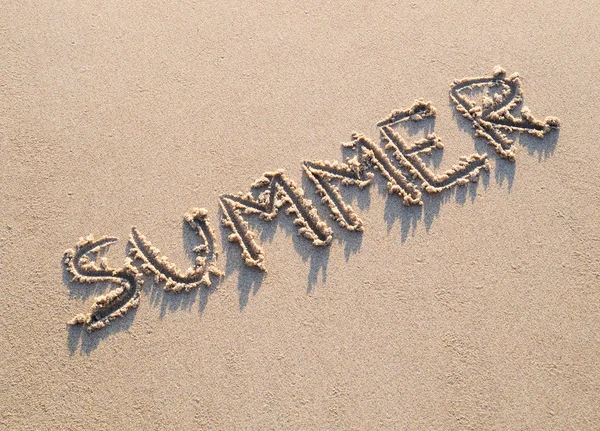 Word summer written in the sand — Stock Photo, Image