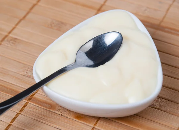 Spoon with custard detail — Stock Photo, Image