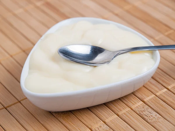 Spoon with custard — Stock Photo, Image