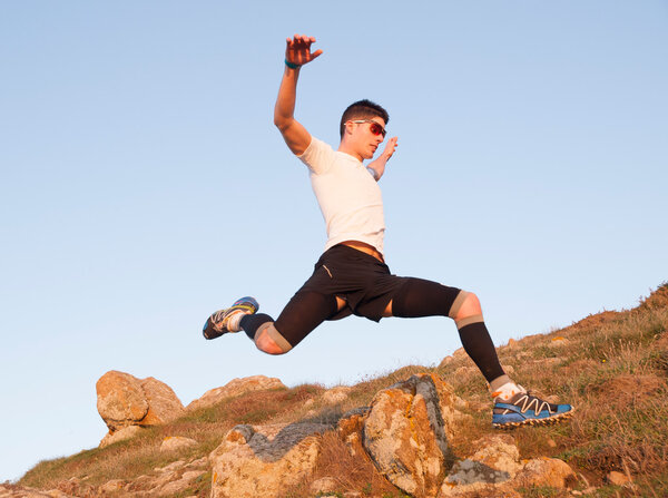 Man practicing trail running and leaping